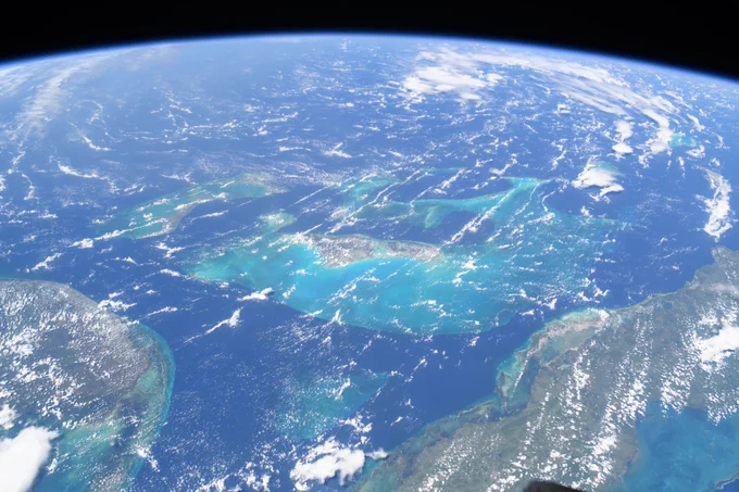(July 24, 2024) -- The clear blue waters surrounding The Bahamas in the Atlantic Ocean are pictured from the International Space Station as it soared 258 miles above.