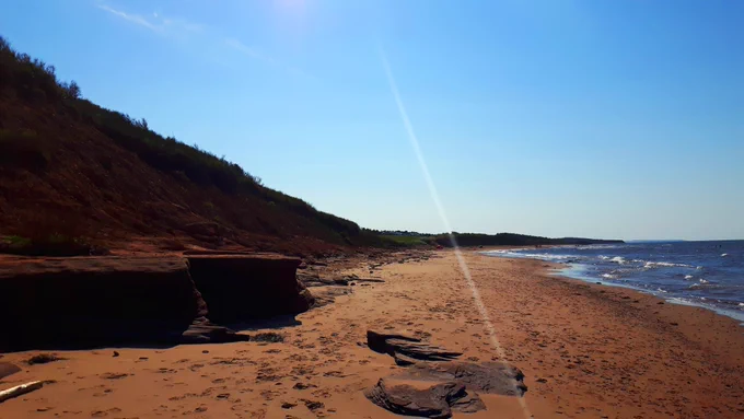 Red sand of Cavendish beach in Prince Edward Island.