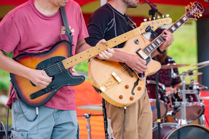 A band playing guitars.