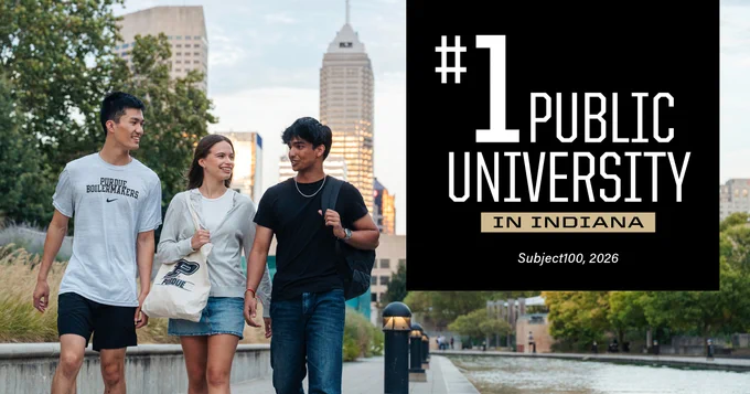 Three people walk along a riverside path in an urban area, with a tall building in the background. They are conversing and smiling. A sign in the image reads "#1 Public University in Indiana Subject100, 2026"