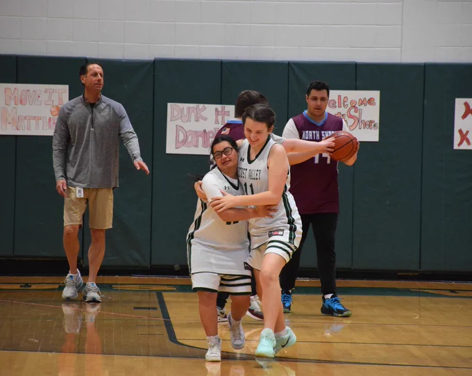 Maneet Bedi and Mikayla Pacini embraced after scoring a basket for the Falcons during the scrimmage.