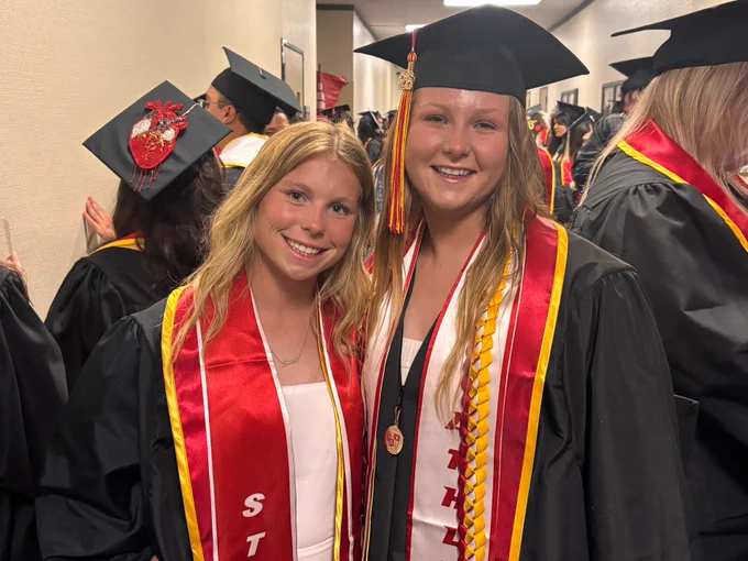 Two Stan State grads hiding from the rain inside.