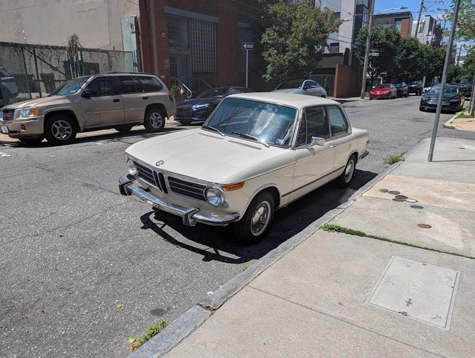 not uncommon to find older cars street parked in philly like this BMW 2002