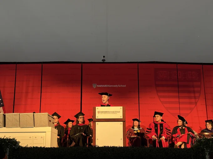 Dean Jeremy Weinstein on stage and delivering a speech.