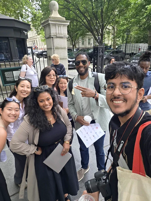 A photograph of Rapid Immigration Support & Empowerment Network members with New York City Public Advocate Jumanee Williams