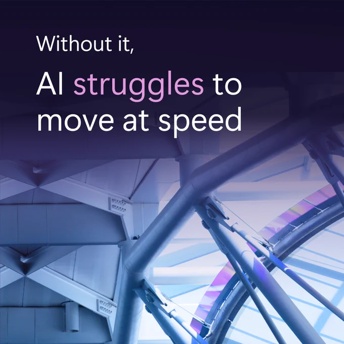 The phrase "Without it, AI struggles to move at speed" is displayed over a futuristic design featuring beams and a circular element.