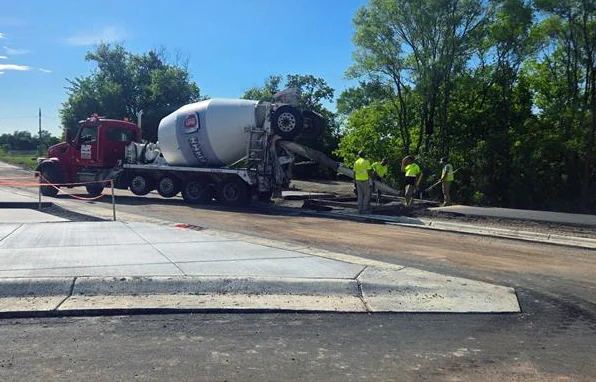 Concrete pouring of sidewalk/road approaches, medians, curbs, etc.