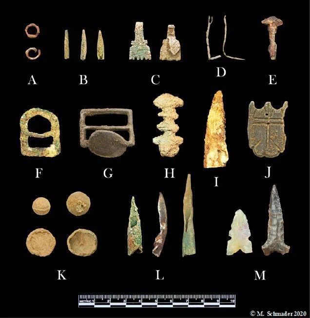 Schmader 2023. Items recovered on surface or by metal detection at Piedras Marcadas Pueblo.
(A) chain mail, (B) bronze clothing lace tags (aglets), (C) brass clothing fasteners, (D) copper
needles, (E) wrought iron nail, (F) bronze buckle, (G) bronze horse bridle cinch, (H) bronze
belt loop, (I) steel sword or dagger tip, (J) bronze medallion, (K) lead arquebus (musket)
balls, (L) copper crossbow boltheads, (M) chipped stone arrow point and spear point. Artifact
photos by M. Schmader, 2020.
