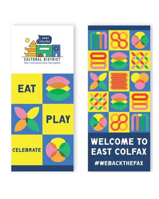 Colorful welcome banners for East Colfax Cultural District featuring geometric tile patterns and the message Eat, Play, Celebrate.