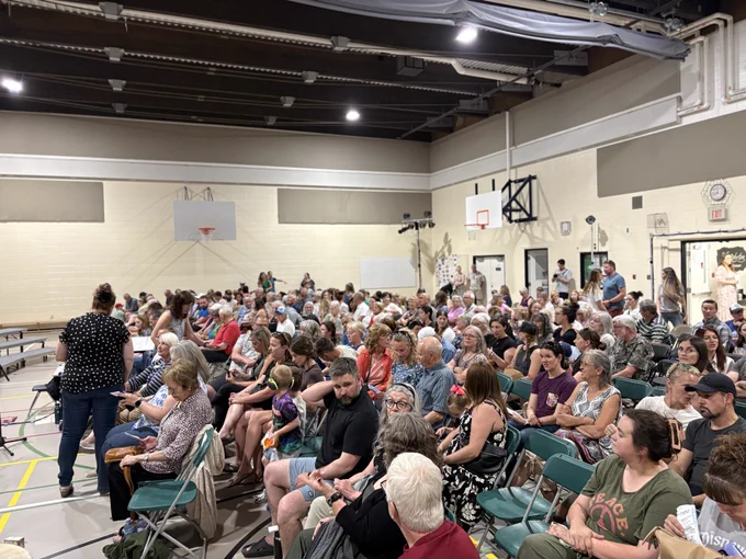 Audience of Rooted in Belonging matinée in the gymnasium.