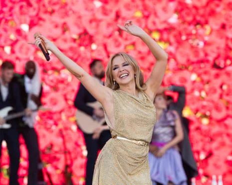 After a high profile battle with breast cancer, Kylie Minogue candidly reflects on her struggle to get back out in the public eye and her determination to perform at Glastonbury.