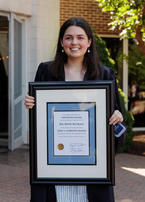 Harrison Award Winner Zoe Markovic holds her framed award