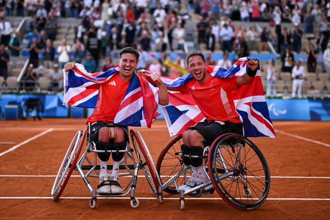 Record-breaking partnership Alfie Hewett and Gordon Reid celebrate becoming the first men’s wheelchair doubles pairing to complete the career Golden Slam at Paris 2024. (Photo by Daniel Kopatsch/Getty Images) 