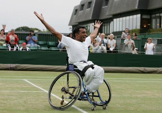 Jayant Mistry celebrates winning the first wheelchair doubles title at The Championships in 2005 - the first British man to triumph at Wimbledon since 1936. (Photo by Phil Cole/Getty Images) 