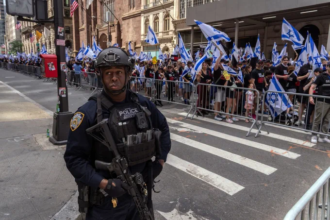 NYPD Emergency Service Unit patrol with rifles at the Israel Day on Fifth parade on June 2, 2024 in New York. (Photo by Adam Gray/Getty Images)