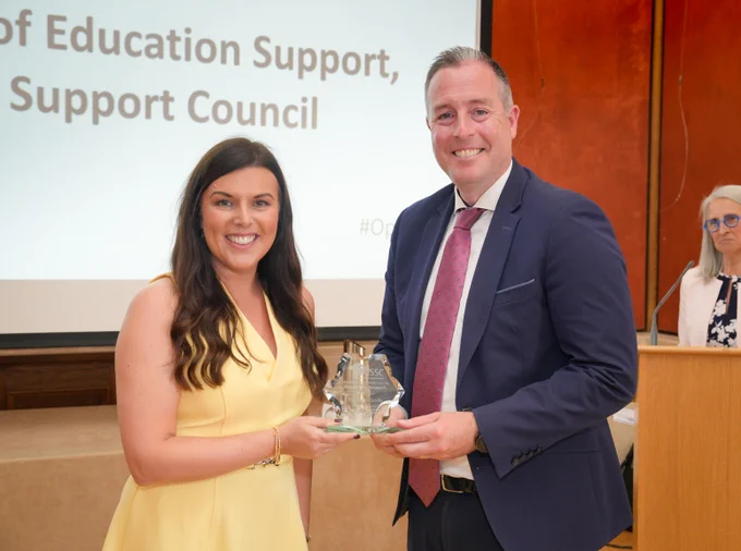 Emma Hylands, Principal, Clare Primary School and Paul Givan, Education Minister. Education Minister is presenting award to Emma. 