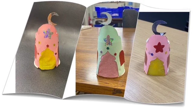 Three handmade paper lanterns decorated with stars and crescent moons, displayed on different surfaces.