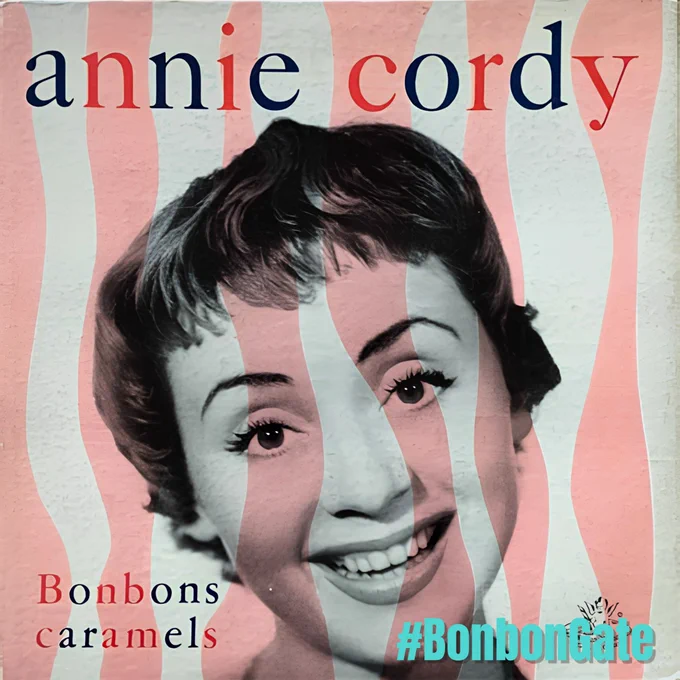 Pochette du 45 tours d'Annie Cordy qui s'appelle Bonbons, Caramels et chocolats.
Son nom est écrit en haut, le titre du 45 tours en bas.
Ajout de la mention "#BonbonGate"