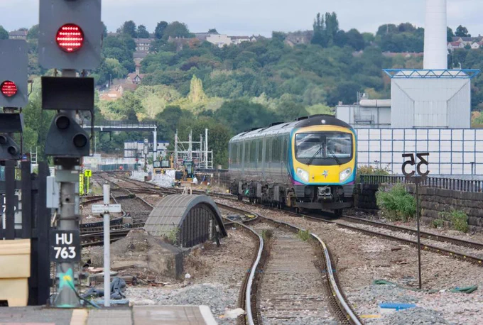TransPennine Express 185115 approaches Huddersfield over its eastern viaduct on August 21, with the 1458 York-Manchester Piccadilly. It’s about to cross John William Street, where Network Rail is replacing two bridge decks during a 30-day blockade in September.  PHILIP HAIGH