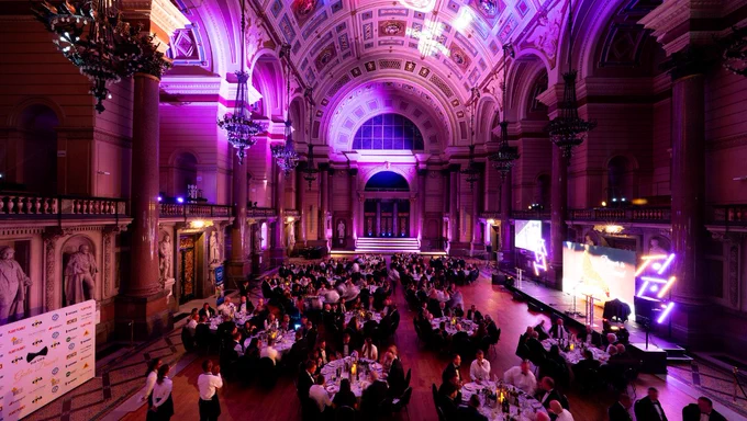 St George's Hall, Great Hall set out for a gala dinner with purple uplighters and a stage to the right of the hall.
