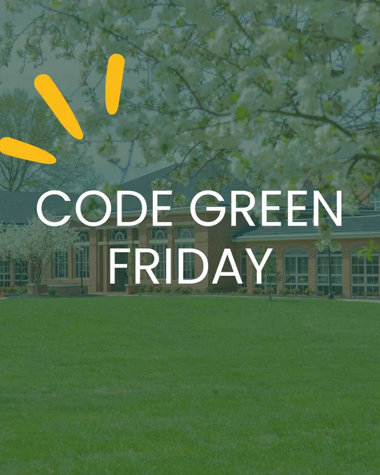 Green lawn in front of a red brick building with blooming trees and "Code Green Friday" text.