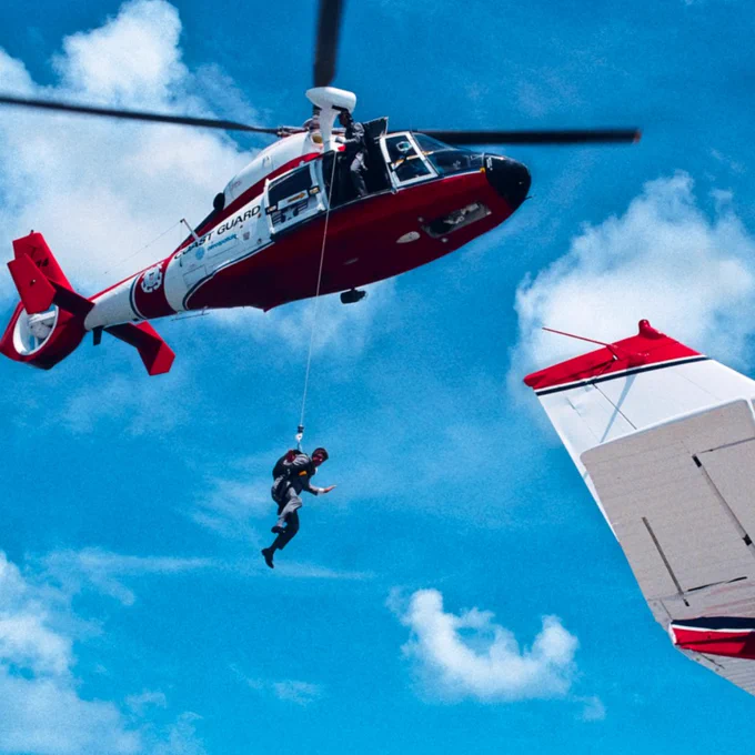 A behind the scenes image from the film Licence To Kill. Timothy Dalton (James Bond) is hanging from a helicopter.