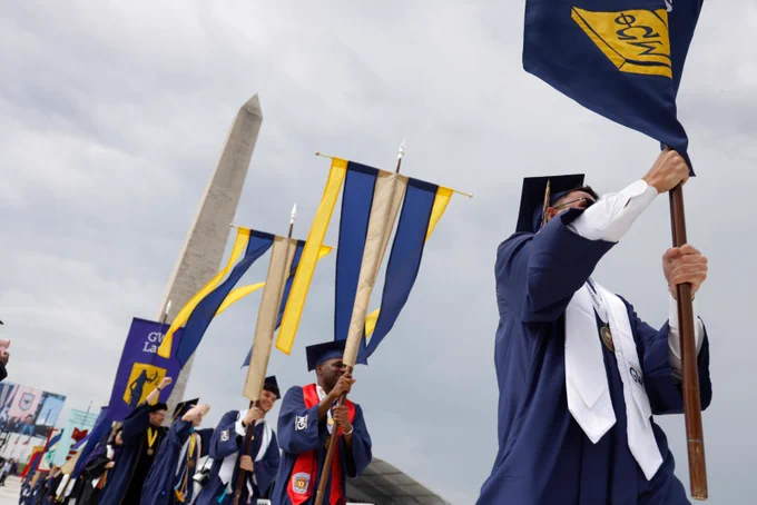 Flagbearers carrying flags in the procession at Commencement.