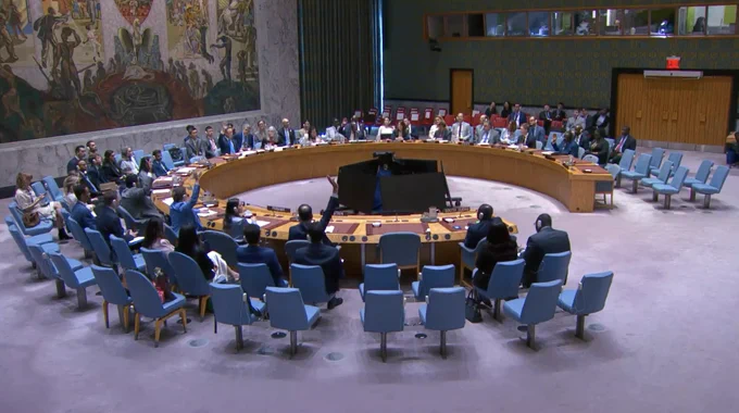 Security Council members vote on the draft resolution.