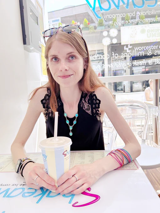 Image Description : A photo of me with a milkshake at Shakeaway.
