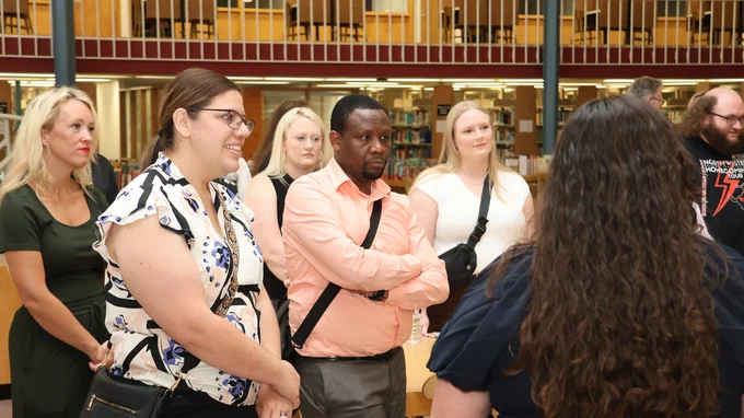 DNP students and community members listen to a presentation by one of the 2025 Northwestern DNP graduates in the J.W. Martin Library during residency week.