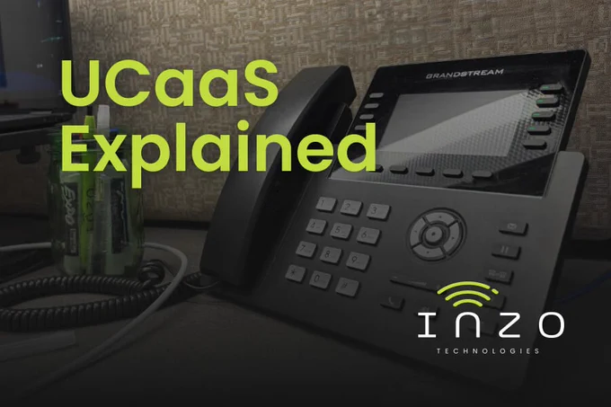Blog graphic titled “UCaaS Explained” over a darkened photo of a Grandstream desk phone.