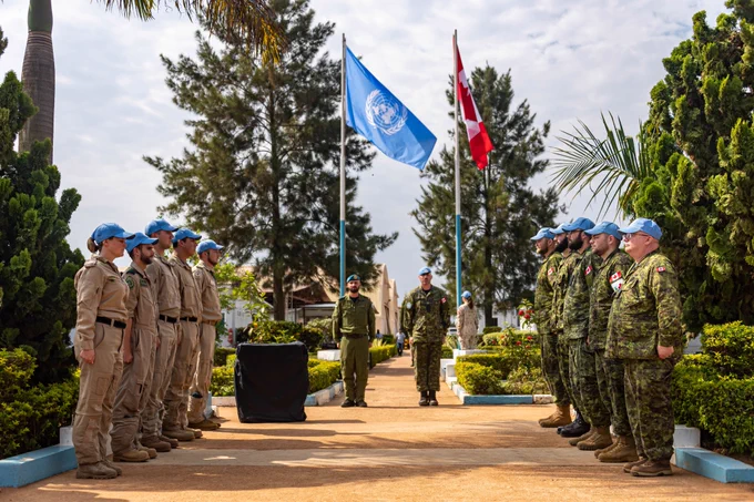 Canadian Armed Forces members deployed on Operation PRESENCE-Uganda stand on parade during a flag raising ceremony at the Regional Service Centre in Entebbe, at the completion of the first rotation of tactical airlift support to United Nations Peacekeeping Operations in Africa on 23 August 2019. Photo: MCpl Jordan Lobb, Canadian Forces Combat Camera