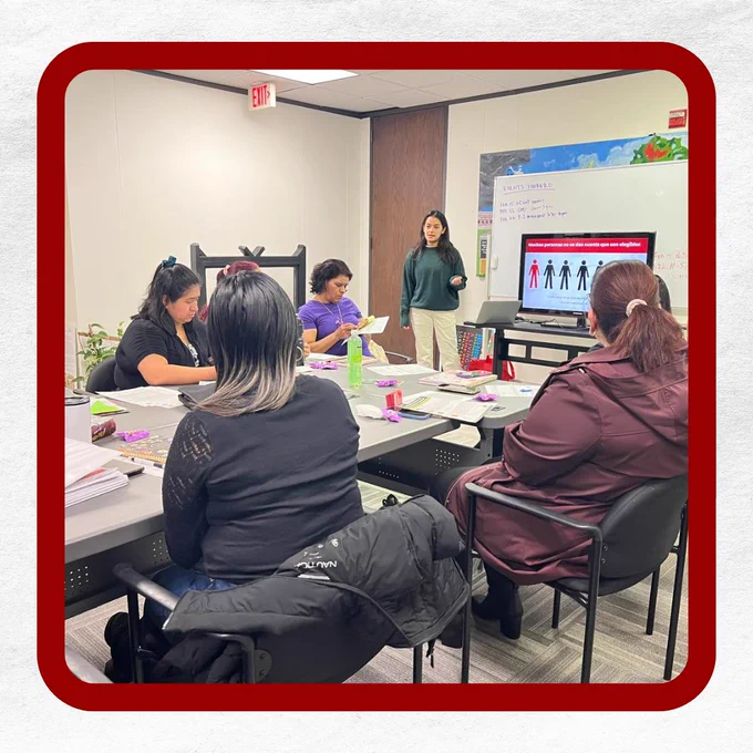 A classroom where a MIMB staff is teaching a class to a group of women.