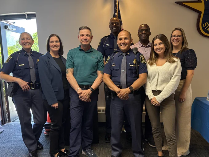 Members of the Communications and Outreach Division with F/lt Shaw at his retirement party