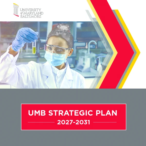 Scientist in a lab coat and gloves holding a test tube in a modern laboratory setting at University of Maryland Baltimore. UMB Strategic Plan 2027-2031