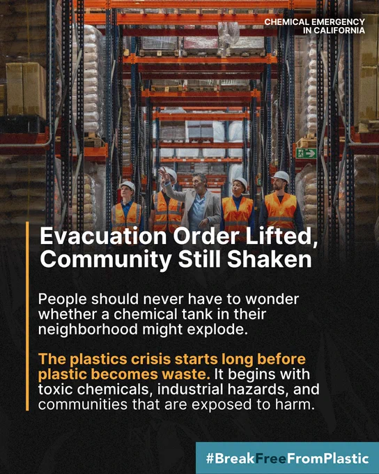 Workers in a warehouse discuss safety after a chemical emergency. Tense yet hopeful mood.