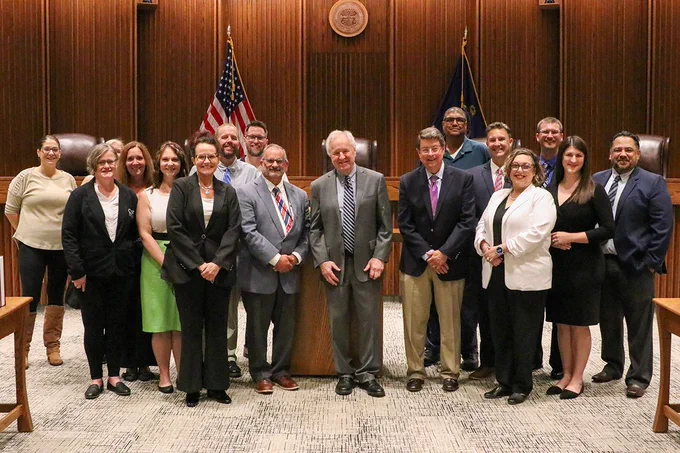 Chief Justice Eric Rosen, center, with judges, court services officers, district court staff, and Office of Judicial Administration staff.