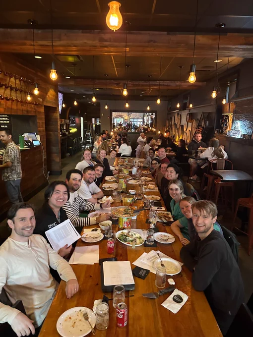 A group of residents and colleagues gathered at a dinner table. 