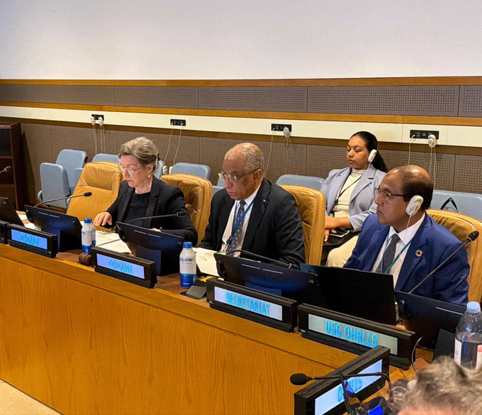 Photo of representatives sitting in the conference room during the meeting.