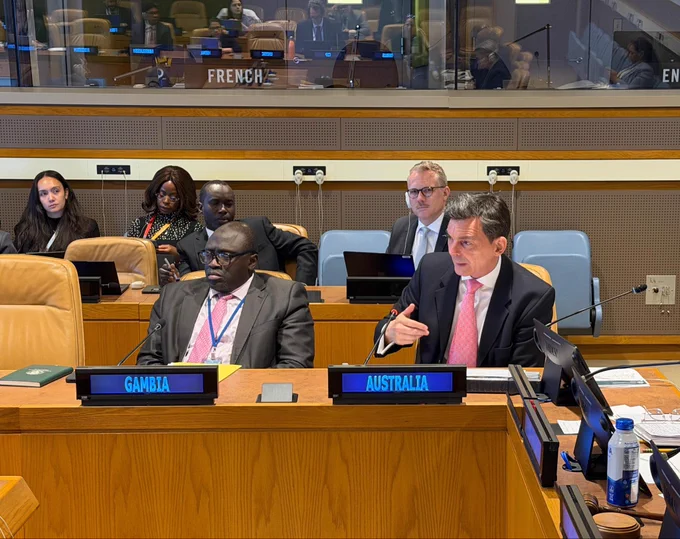 Photo of representatives sitting in the conference room during the meeting.