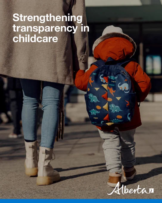 A small child wearing a red jacket and a blue dinosaur-pattern backpack walks beside an adult on a sidewalk, holding the adult’s hand. The adult wears a beige coat, jeans, and light-colored boots. White text on the image reads “Strengthening transparency in childcare,” with an Alberta logo in the bottom right corner.