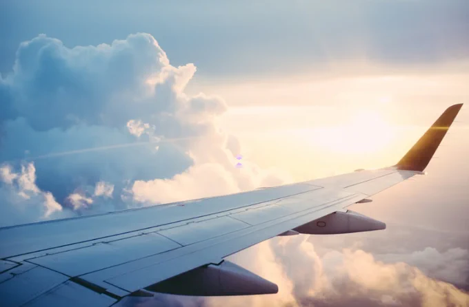 Airplane wing in the sky