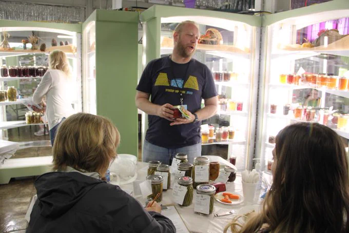 Ben Chapman talking to judges at the N.C. State Fair about his jams and jellies. 