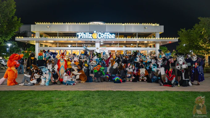 Assuming I can count, it's 62 furries posing in front of a Philz Coffee, plus a few more in the background