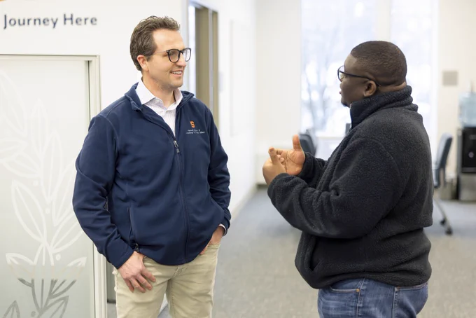 Peter Forsgren '97 speaking with a student at an entrepreneurship event.