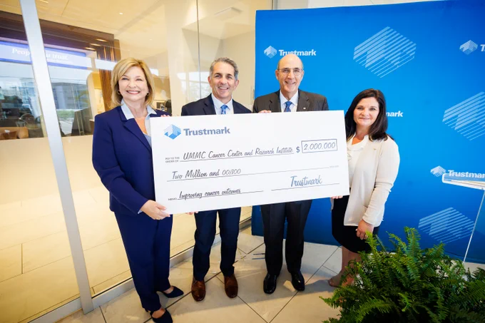 Celebrating Trustmark's $2 million gift to the CCRI campaign are, from left, Dr. LouAnn Woodward, vice chancellor for health affairs; Dr. Rod Rocconi, Ergon Chair for Cancer Research and director of the UMMC Cancer Center and Research Institute; Art Stevens, president of retail banking at Trustmark; and Melanie Morgan, executive vice president and director of corporate communications and marketing at Trustmark.

