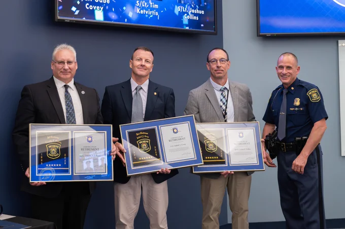 group photo holding awards