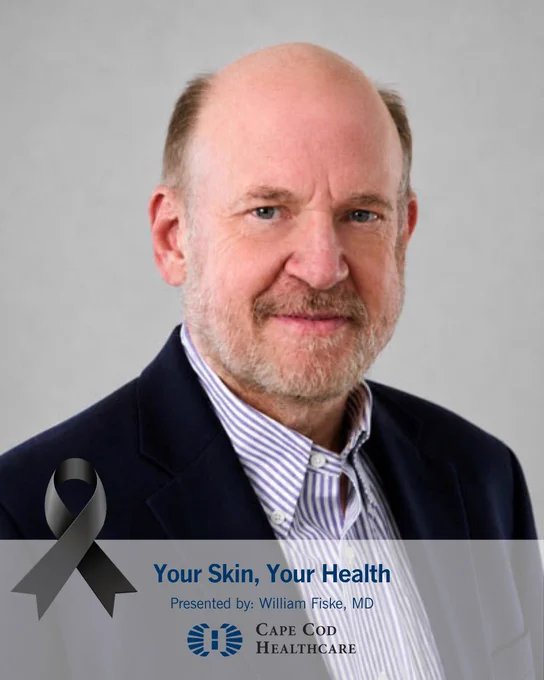 This is an image of a person in a suit with a light gray background. A black awareness ribbon is placed at the bottom left. Text reads: “Your Skin, Your Health. Presented by: William Fiske, MD.” The Cape Cod Healthcare logo is also visible.