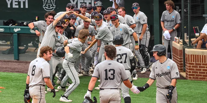 UWM outfielder Charlie Marion celebrates with his team after hitting a three-run home run in the fourth inning against Auburn in the first round of the NCAA Tournament on Friday in Auburn, Alabama.
