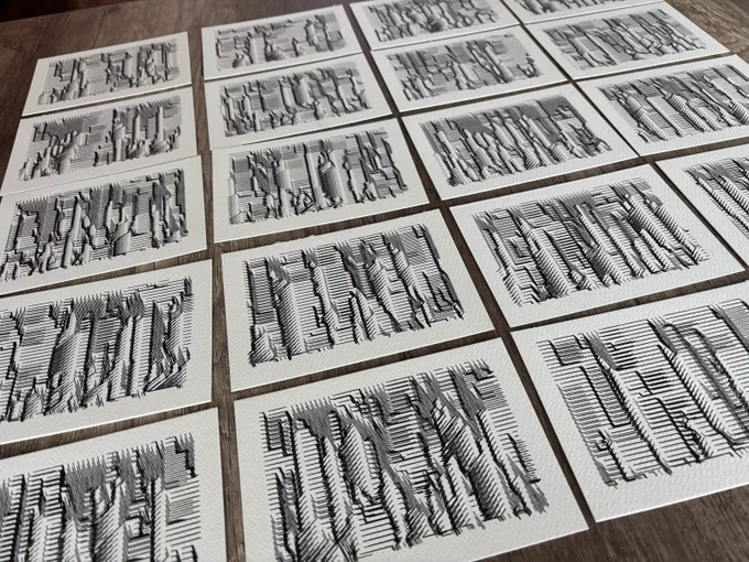 Sixteen black and white geometric line drawings on paper, arranged in a grid on a wooden surface.